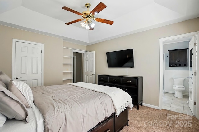 2379 Whitley Rd, Fort Mill, SC 29708 - bedroom with a tray ceiling, light carpet, ensuite bathroom, ceiling fan, and light tile patterned flooring