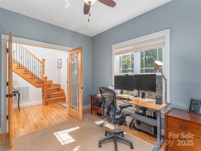office area featuring ceiling fan, french doors, wood finished floors, and visible vents