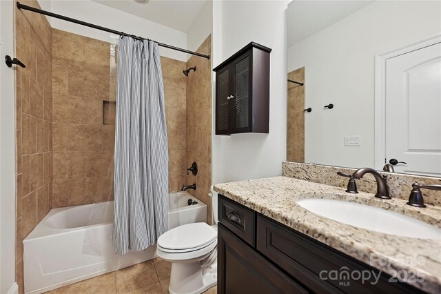bathroom with toilet, tile patterned floors, shower / bath combo, and vanity