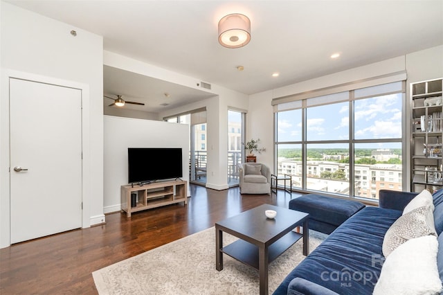 living room featuring recessed lighting, a ceiling fan, wood finished floors, and visible vents