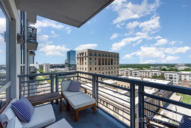 balcony featuring a view of city