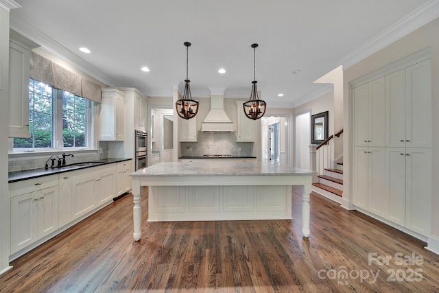 128 Spears Creek Dr, Mooresville, NC 28117 - kitchen featuring premium range hood, tasteful backsplash, a sink, double oven, and ornamental molding