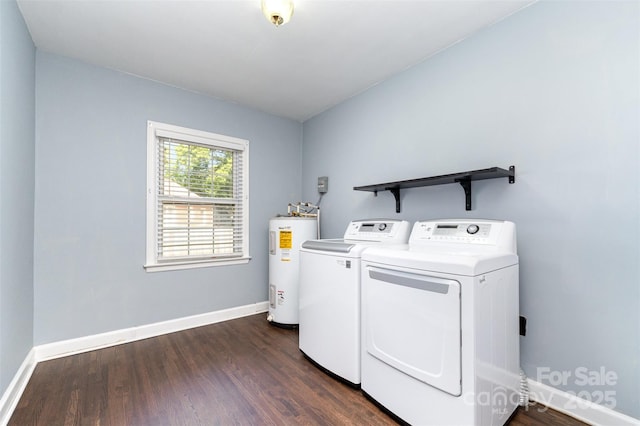 laundry area featuring laundry area, baseboards, water heater, washer and dryer, and dark wood-type flooring