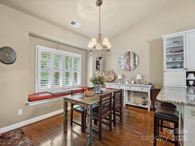 dining area with visible vents, vaulted ceiling, dark wood finished floors, baseboards, and a notable chandelier