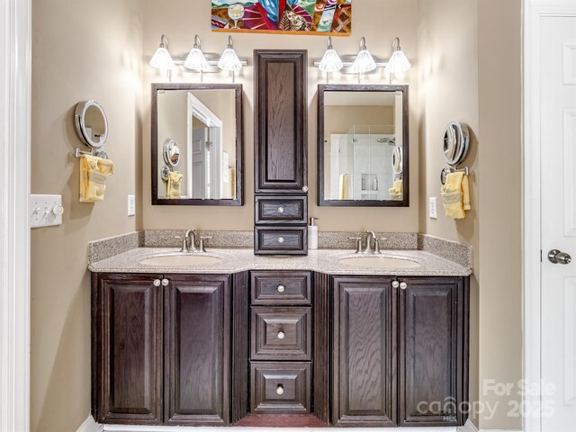 full bath with double vanity and a sink