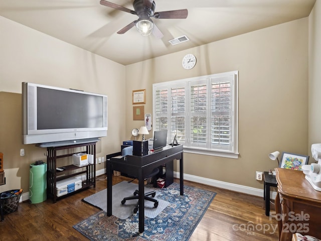 office area with visible vents, a ceiling fan, baseboards, and wood finished floors