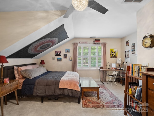 carpeted bedroom with vaulted ceiling and visible vents