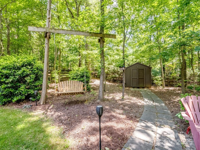 view of yard featuring a storage shed and an outdoor structure