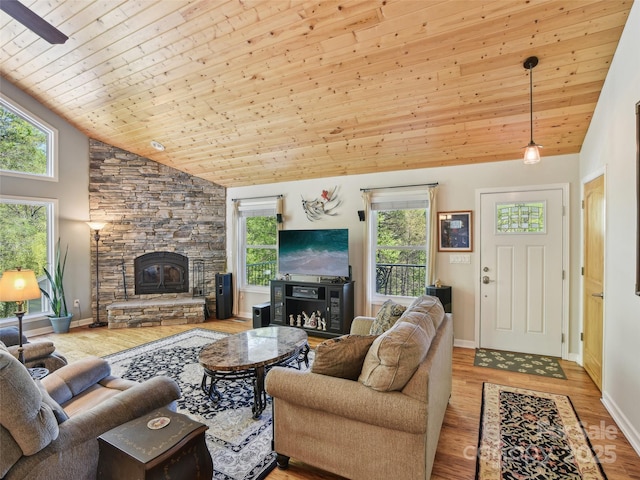 living area featuring wood ceiling, plenty of natural light, high vaulted ceiling, and wood finished floors