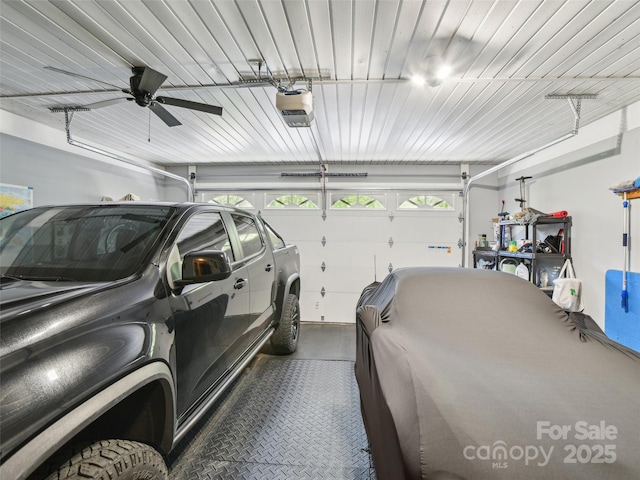 garage featuring a garage door opener and a ceiling fan