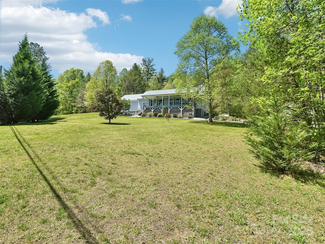 view of yard with covered porch