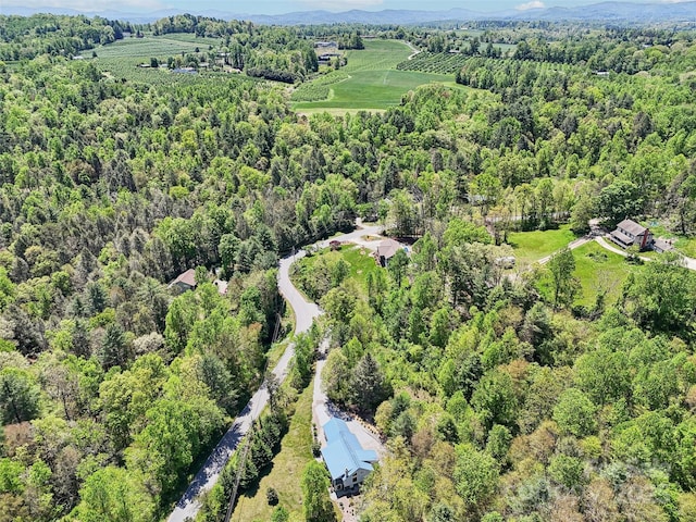 drone / aerial view featuring a forest view