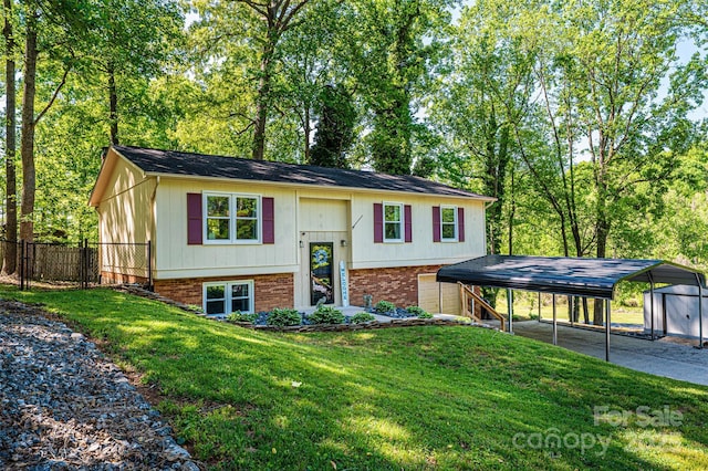 1018 Autumn Ln, Hickory, NC 28602 - bi-level home featuring brick siding, fence, a front lawn, and a carport
