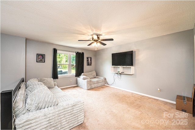 1018 Autumn Ln, Hickory, NC 28602 - carpeted living area featuring baseboards, a textured ceiling, and ceiling fan