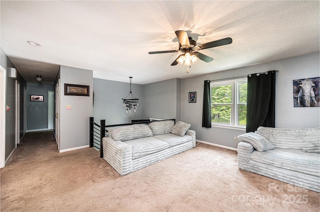 1018 Autumn Ln, Hickory, NC 28602 - living area featuring carpet floors, a textured ceiling, baseboards, and ceiling fan
