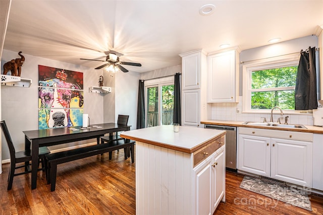 1018 Autumn Ln, Hickory, NC 28602 - kitchen featuring a center island, dishwasher, a sink, white cabinetry, and dark wood-type flooring