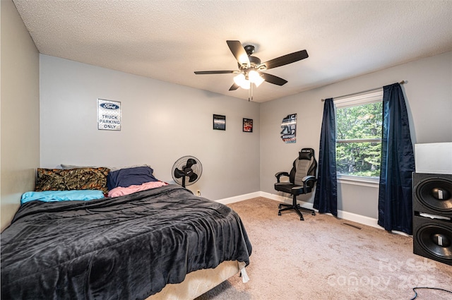 1018 Autumn Ln, Hickory, NC 28602 - carpeted bedroom with baseboards, a ceiling fan, a textured ceiling, and visible vents