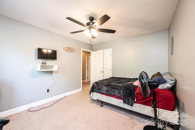 1018 Autumn Ln, Hickory, NC 28602 - carpeted bedroom featuring baseboards and ceiling fan