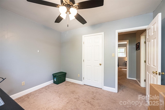 1018 Autumn Ln, Hickory, NC 28602 - unfurnished bedroom with carpet floors, a ceiling fan, and baseboards