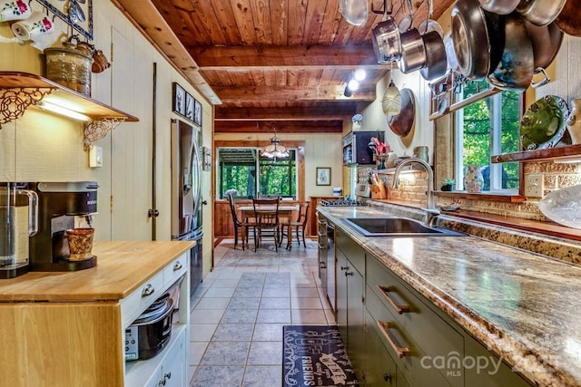 76 Archer Rd, Saluda, NC 28773 - kitchen with wood ceiling with exposed beams, a sink, wood counters, stainless steel appliances, and light tile patterned floors