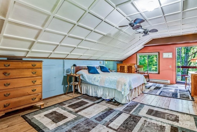 76 Archer Rd, Saluda, NC 28773 - bedroom with hardwood / wood-style floors, a baseboard radiator, vaulted ceiling, access to exterior, and baseboards