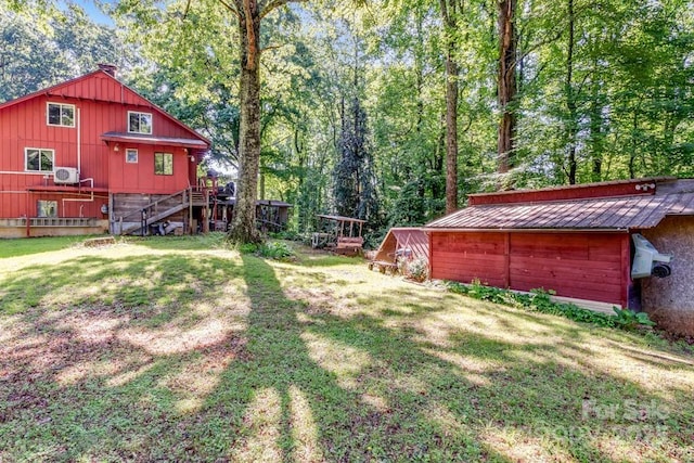 76 Archer Rd, Saluda, NC 28773 - view of grassy yard with stairs and an outdoor structure
