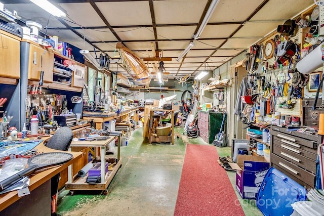 76 Archer Rd, Saluda, NC 28773 - misc room featuring a workshop area and concrete flooring