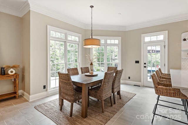 dining space with crown molding, baseboards, visible vents, and light tile patterned floors