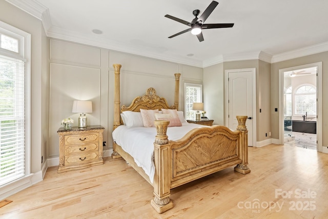 bedroom featuring crown molding, light wood-style flooring, ceiling fan, and baseboards