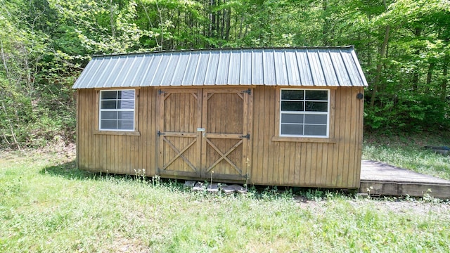 view of shed featuring a forest view