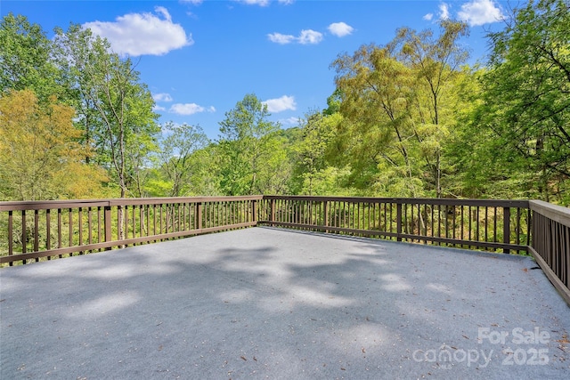 view of patio featuring a wooded view