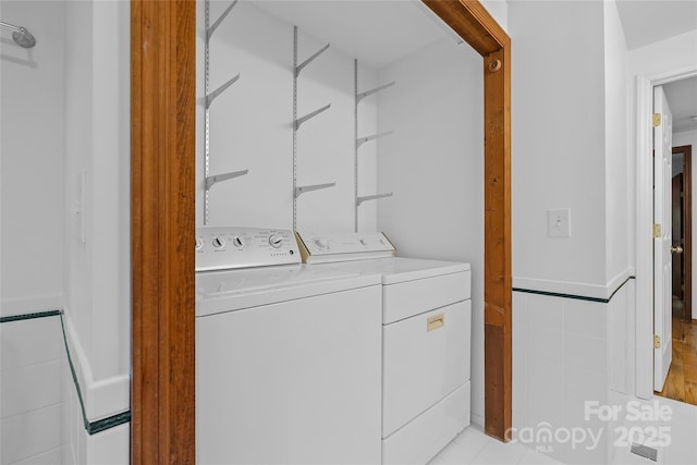 laundry room with washer and dryer and laundry area