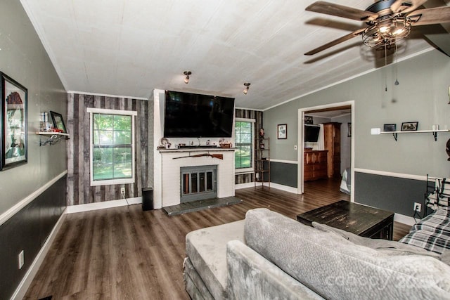 7733 Skyline Dr, Sherrills Ford, NC 28673 - living area with plenty of natural light, wood finished floors, a ceiling fan, ornamental molding, and a fireplace
