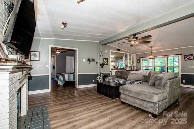 7733 Skyline Dr, Sherrills Ford, NC 28673 - living area with ceiling fan, wood finished floors, a brick fireplace, and baseboards