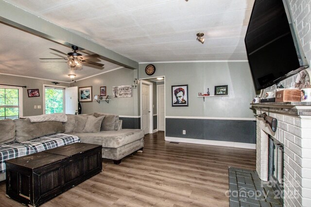 7733 Skyline Dr, Sherrills Ford, NC 28673 - living room featuring wood finished floors, ceiling fan, crown molding, and a brick fireplace