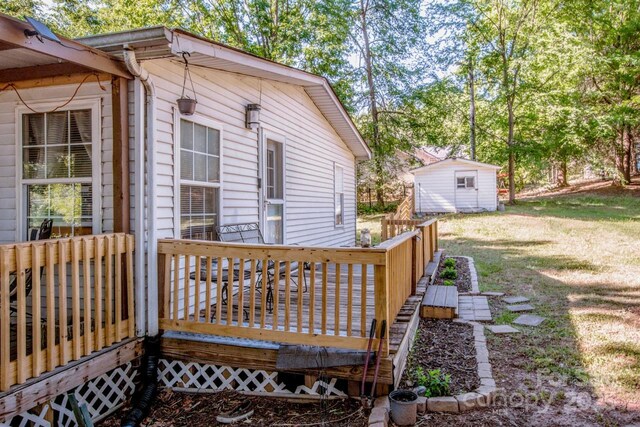 7733 Skyline Dr, Sherrills Ford, NC 28673 - wooden deck featuring a yard and an outbuilding