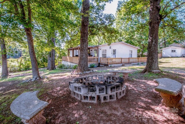7733 Skyline Dr, Sherrills Ford, NC 28673 - view of yard with an outdoor fire pit and a wooden deck