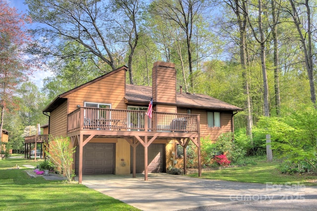 39 Oak Ct, Fletcher, NC 28732 - view of front of house featuring a chimney, driveway, an attached garage, and a front lawn