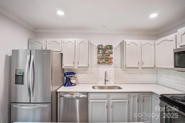 9214 Arbourgate Meadows Ln, Charlotte, NC 28277 - kitchen with a sink, appliances with stainless steel finishes, ornamental molding, and light countertops