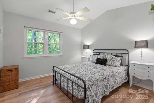 9214 Arbourgate Meadows Ln, Charlotte, NC 28277 - bedroom featuring baseboards, lofted ceiling, wood finished floors, and visible vents