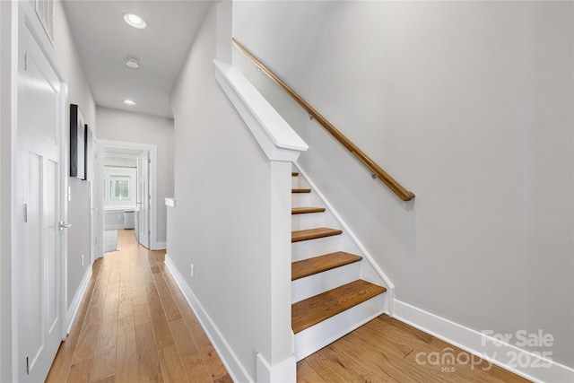 stairs with recessed lighting, baseboards, wood finished floors, and visible vents