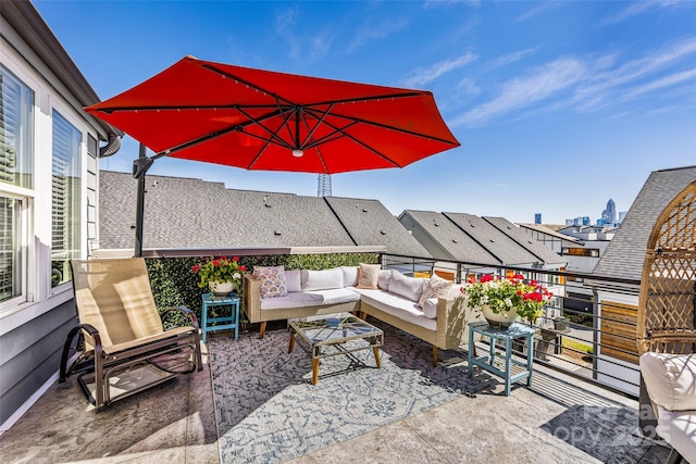 view of patio featuring outdoor lounge area and a balcony