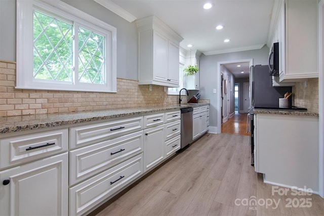 1514 Wensley Dr, Charlotte, NC 28210 - kitchen with appliances with stainless steel finishes, white cabinets, backsplash, crown molding, and recessed lighting