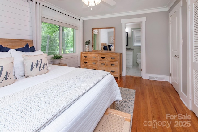 1514 Wensley Dr, Charlotte, NC 28210 - bedroom featuring light wood-style flooring, ornamental molding, baseboards, ensuite bath, and ceiling fan