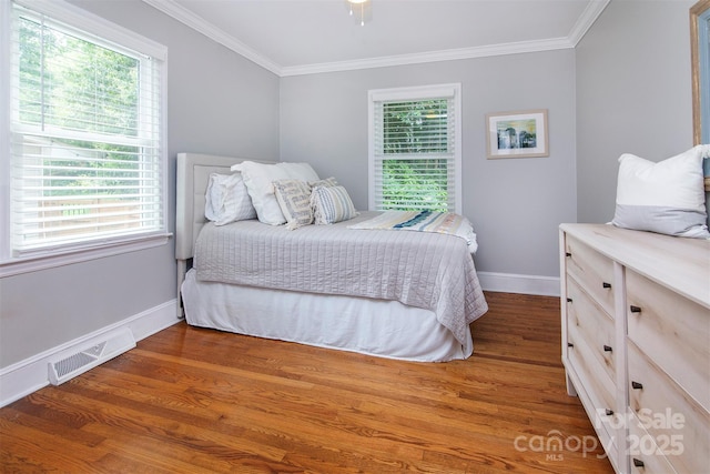 1514 Wensley Dr, Charlotte, NC 28210 - bedroom with baseboards, ornamental molding, multiple windows, and wood finished floors