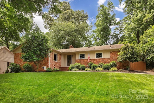 1514 Wensley Dr, Charlotte, NC 28210 - ranch-style home featuring brick siding, a front lawn, and a chimney