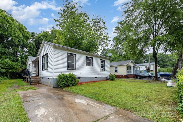 2622 Hemphill St, Charlotte, NC 28208 - view of front of property with crawl space, a front yard, and concrete driveway