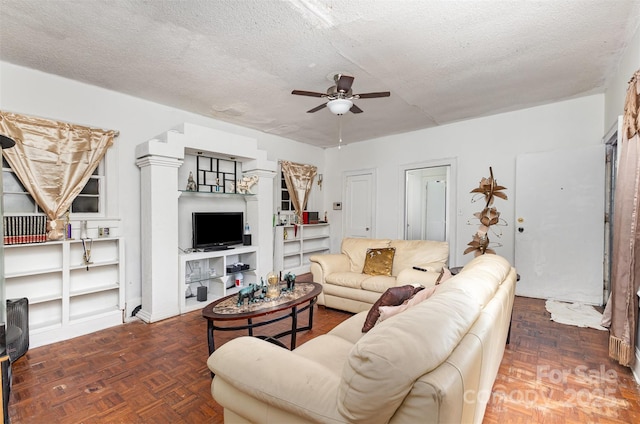 2622 Hemphill St, Charlotte, NC 28208 - living area featuring a ceiling fan, a textured ceiling, and stairway