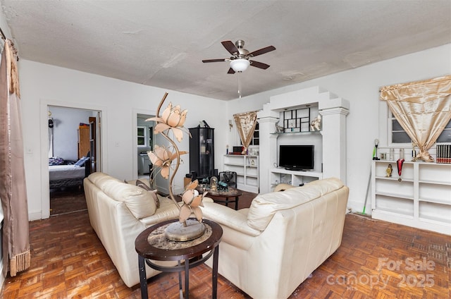 2622 Hemphill St, Charlotte, NC 28208 - living area featuring ceiling fan and a textured ceiling