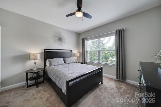 8702 Aspinwall Dr, Charlotte, NC 28216 - carpeted bedroom featuring baseboards and a ceiling fan